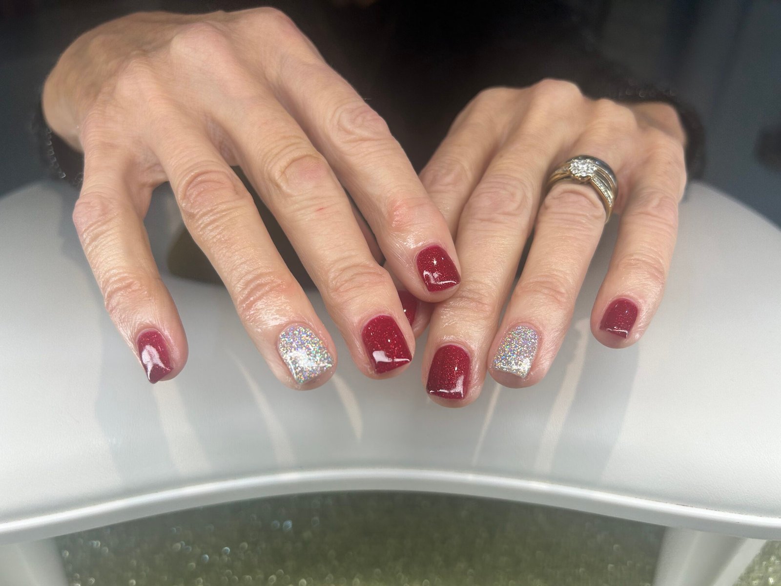 Hands red with glitter